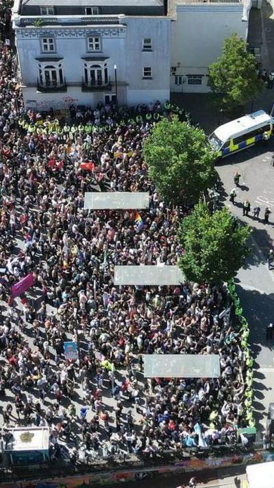 An aerial view of a group of people at a protest.