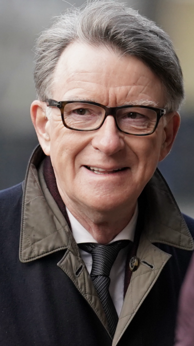 Peter Mandelson - smiling, with glasses and grey hair