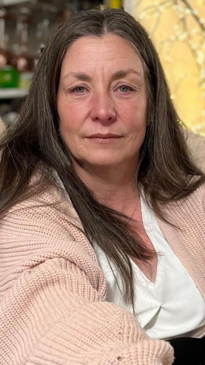 Lady looks at the camera.