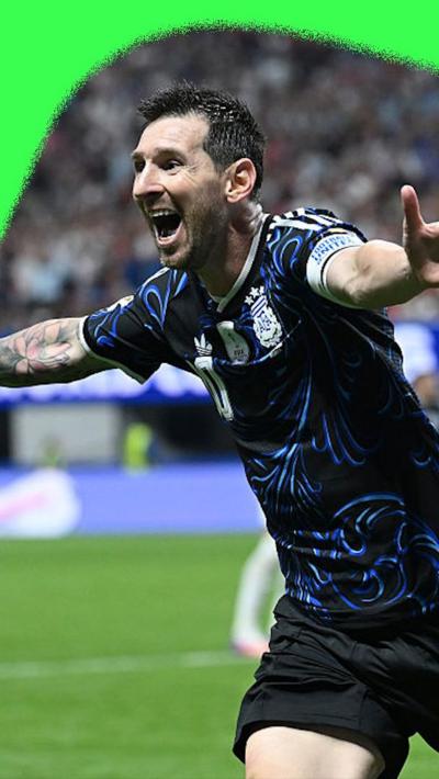 Lionel Messi with his arms wide apart to celebrate Argentina scoring a second goal against England