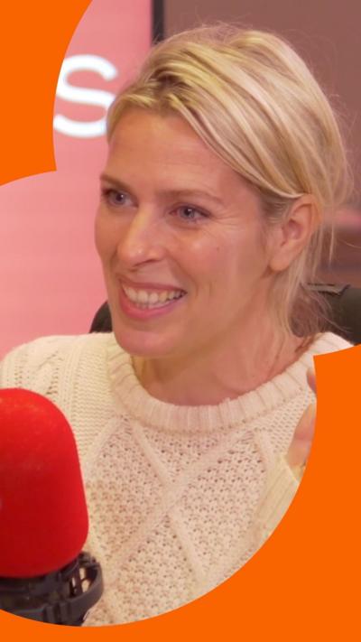 Sara Pascoe smiles. She has blonde hair, tied back and wars a white, woolen sweater.