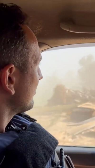 Hugo Bachega looking out of a window in a car