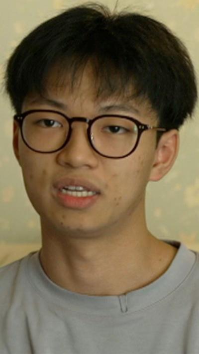 Dominic Abdullah wears black glasses with black hair
