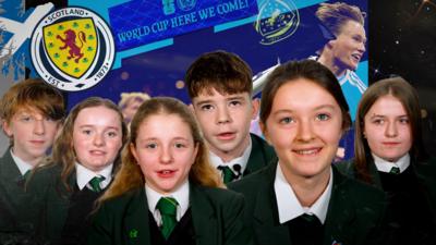 children with a scotland football team graphic behind them