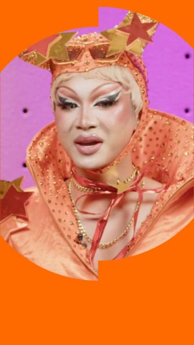 Gawdland is wearing an orange had with horns and an orange top.