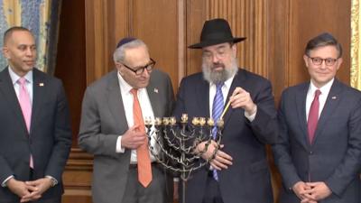 From left, Hakeem Jeffries, Chuck Schumer and Mike Johnson during the Menorah lighting ceremony.