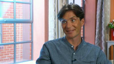 Cillian Murphy wearing a blue denim shirt