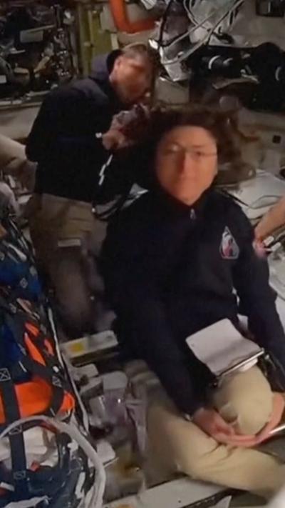 Two astronauts in space