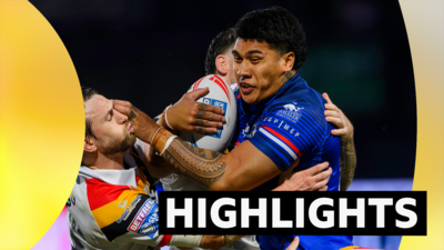 Wakefield's Tray Lolesio fends off Bradford's Joe Mellor.
