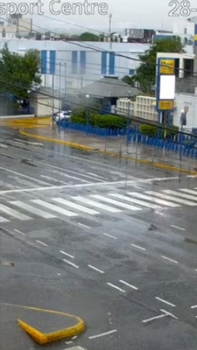 A still from CCTV footage showing a road wet from rain