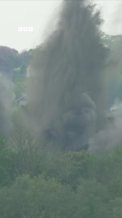 Lots of sand and debris flies into there are as a WW2 bomb is detonated