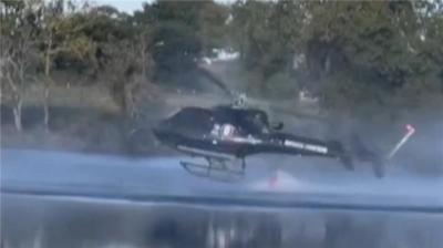 Helicopter near a lake
