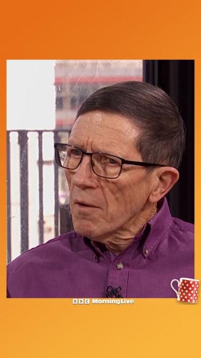 Simon Bain in the Morning Live studio with a purple shirt on