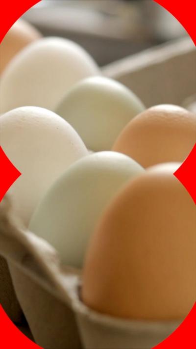 A number of eggs sitting in an egg carton.
