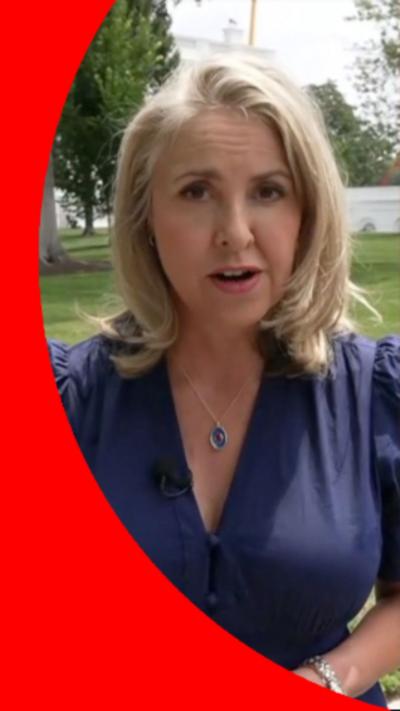 North America Editor, Sarah Smith, has shoulder-length blonde hair and is wearing a purple top.