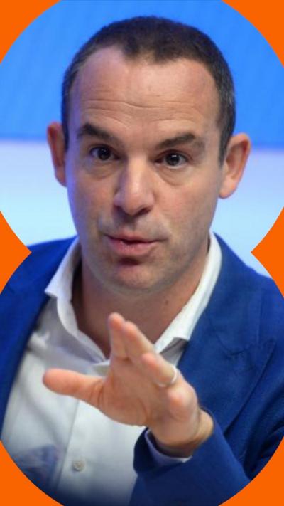 Martin Lewis gestures with his left hand while talking to someone
