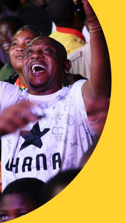 A Ghana fan celebrates in the crowd
