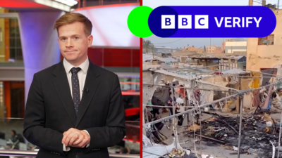 A composite image with a BBC Verify presenter on the left side, and an image of destruction in Gaza on the right. There is also the BBC Verify logo, which is green and blue, with white writing, on the right-hand side of the screen.