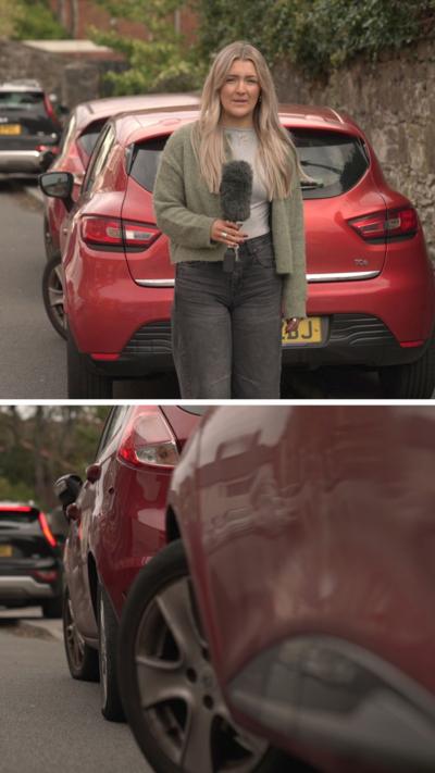 A woman with long blonde hair wearing a green cardigan is stood in front of a red car with a microphone in her hand