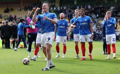Portsmouth's Colby Bishop celebrates with his teammates