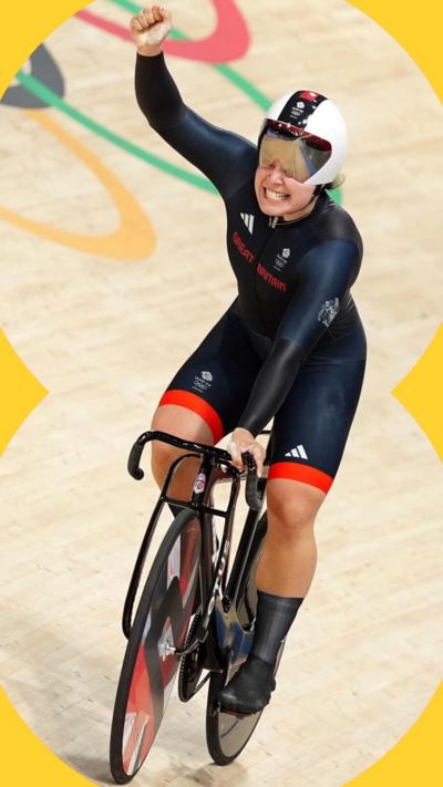 Sophie Capewell, in a dark blue Team GB bodysuit, cycles on a track, celebrating her Paris 2024 Olympics win