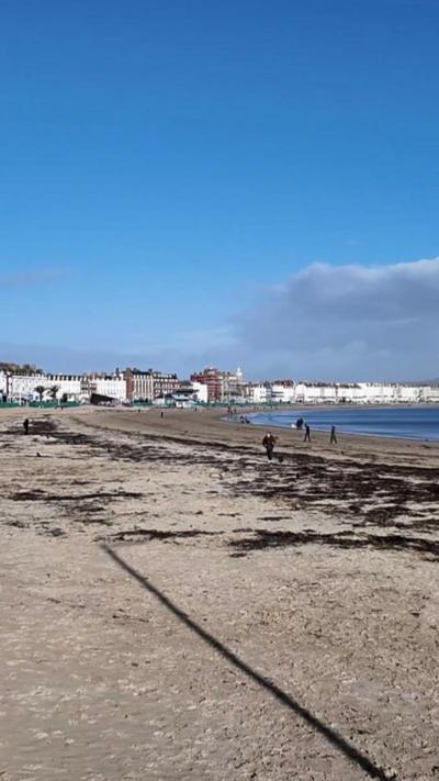 Beach with buildings in the background. 