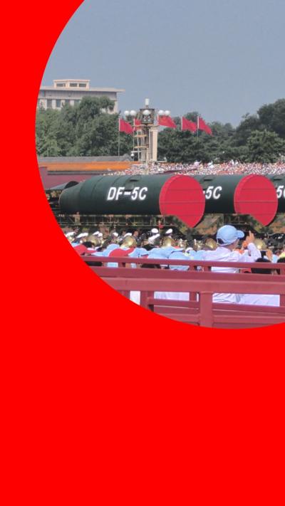DF-5C missiles seen during a military parade in front of crowds of spectators 