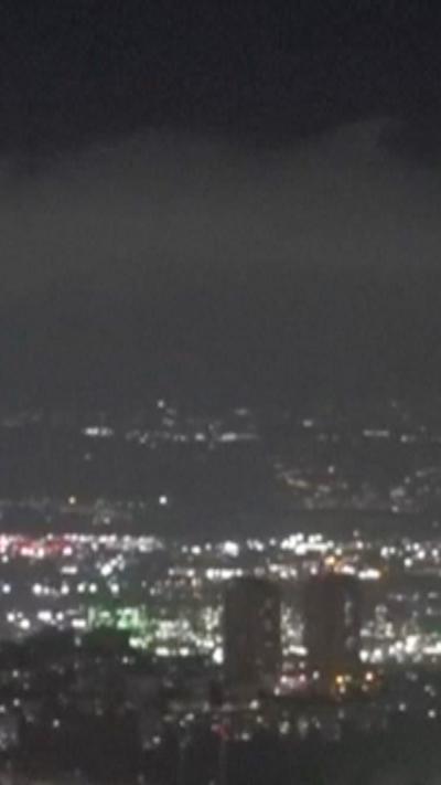 Haifa skyline at night. City lights go into the distance.