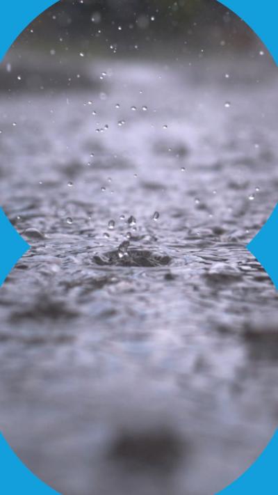 A close-up of raindrops on a flat surface.