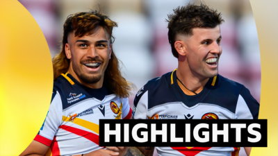 Two Catalans players smile while wearing gum shields