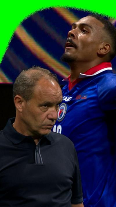 Wilson Isidor celebrates for Haiti while manager Sebastien Migne does not