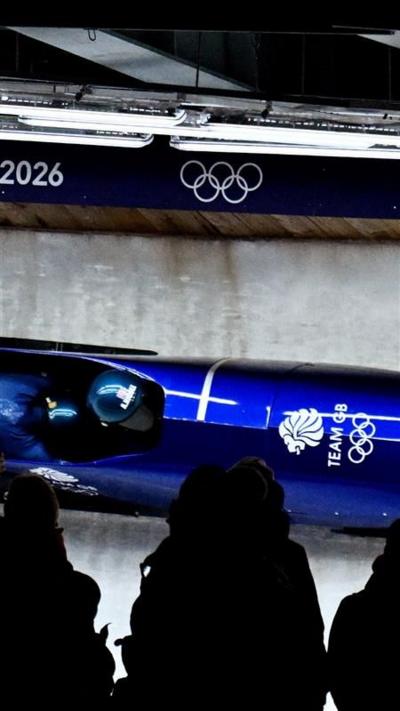 A blue Team GB bobsleigh on the track at the winter olympics in Italy