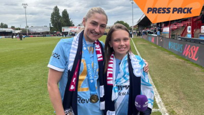 press packer and main city player smiling at the camera 