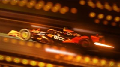 A modern F1 car with stylised overlay graphics and bright lights. 