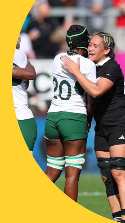 New Zealand players and South Africa players embrace after the match 