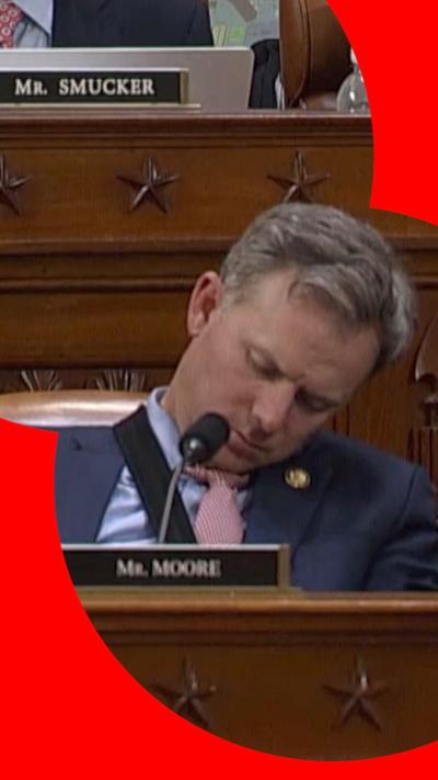 Representative Blake Moore asleep in his chair
