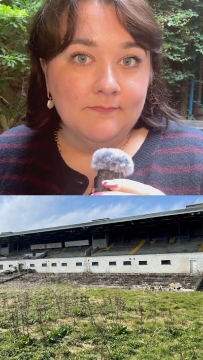 Jess Lawrence has sort dark hair and is holding a small mic. Below is a picture of Casement Park. 