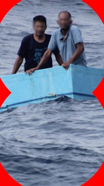 Two fishermen in a blue cool box