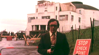 Reporter outside a polling station.