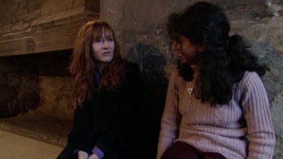 JK Rowling and Konnie Huq sit on a bench