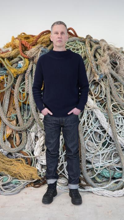 Artist David Shrigley with his new artwork 'Exhibition of Old Rope' at the Stephen Friedman Gallery in central London.