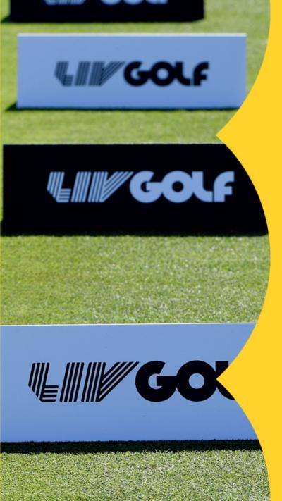 Three 'LIV Golf' ad boards stood upright on a patch of green grass