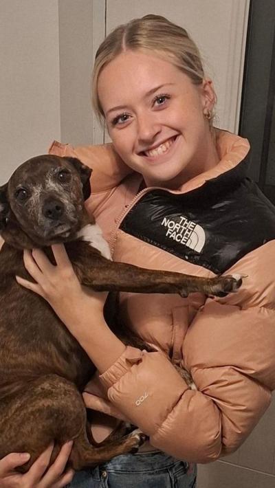 Megan holding a dog