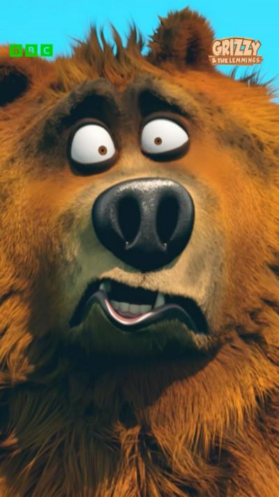 A grizzly bear looked singed by fire and confused.