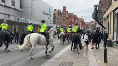 Mounted police push back protesters