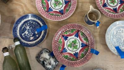 Various items of multi-coloured pottery recovered from a shipwreck