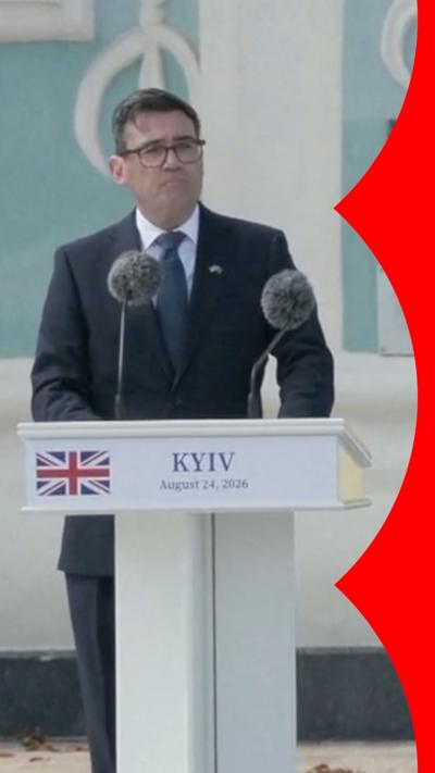 UK Prime Minster Andy Burnham stands behind a podium in Kyiv, Ukraine