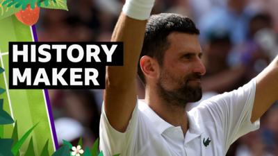 Novak Djokovic raises arms in celebration 