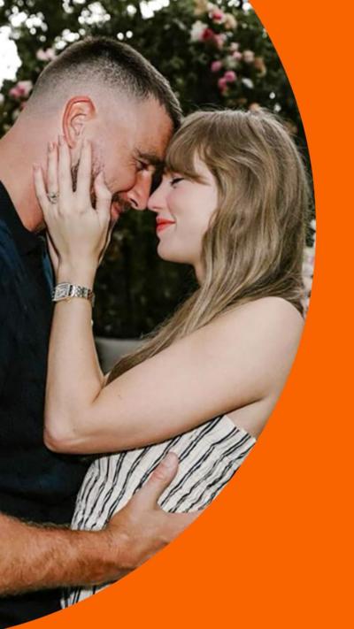 A man and a woman rest their foreheads against each other