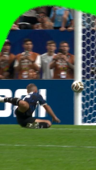 Alexis Mac Allister on the ground as he tries to score a goal for Argentina but misses.